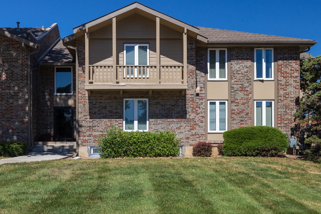 The exterior of Regent’s Walk Apartment Homes, featuring well-maintained buildings and landscaping.