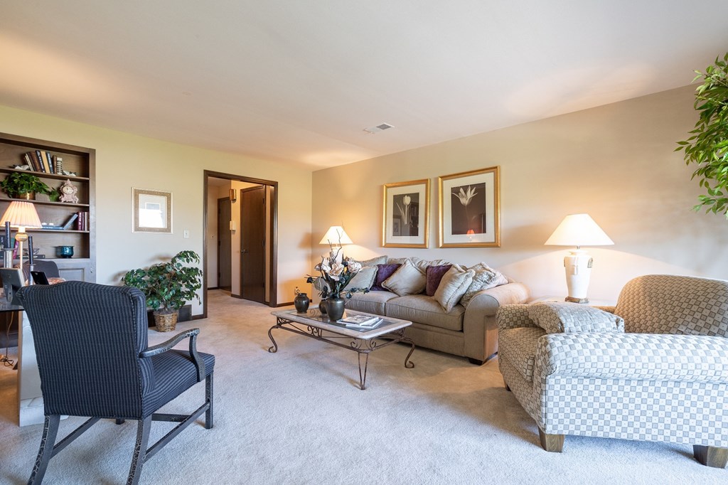A well-lit living room in a two-bedroom apartment at Regent’s Walk Apartment Homes, offering plenty of space.