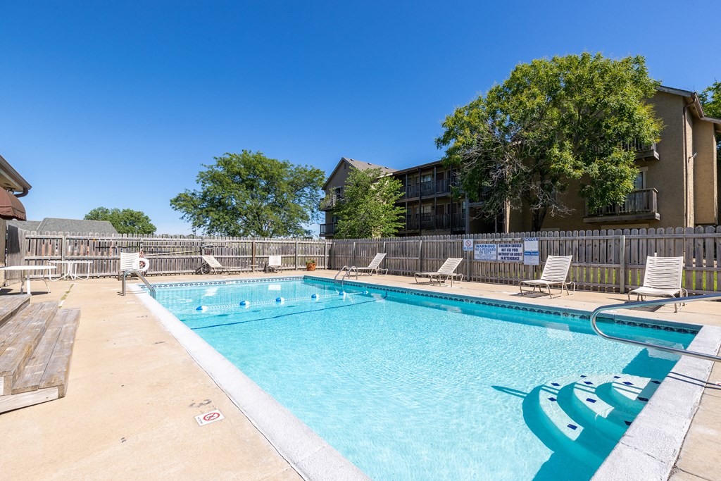 Southfork Apartments - Clubhouse Pool Area Swimming pool in front of the Southfork Apartments clubhouse.