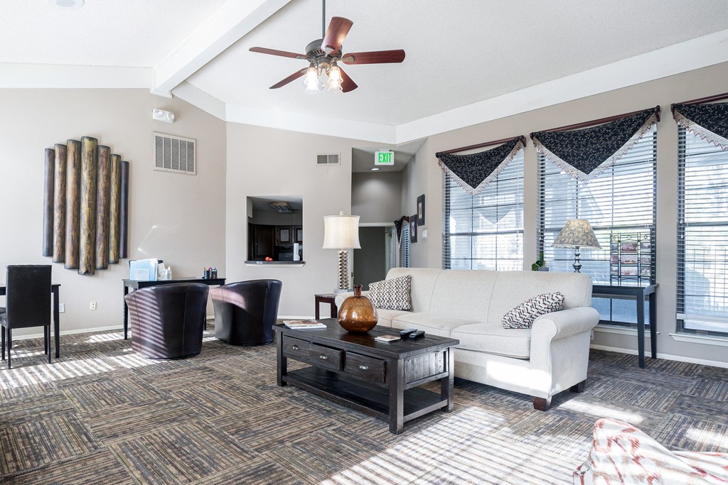 Three Lakes Clubhouse Lobby with a comfortable seating area featuring a sofa and coffee table.