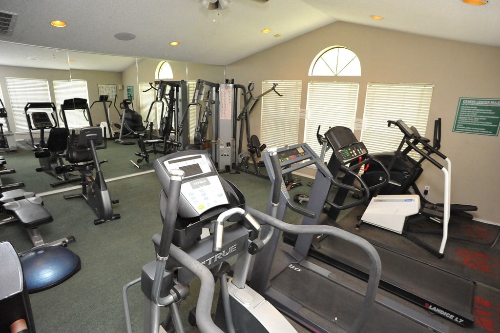 Fitness area at Three Lakes Community featuring exercise machines.