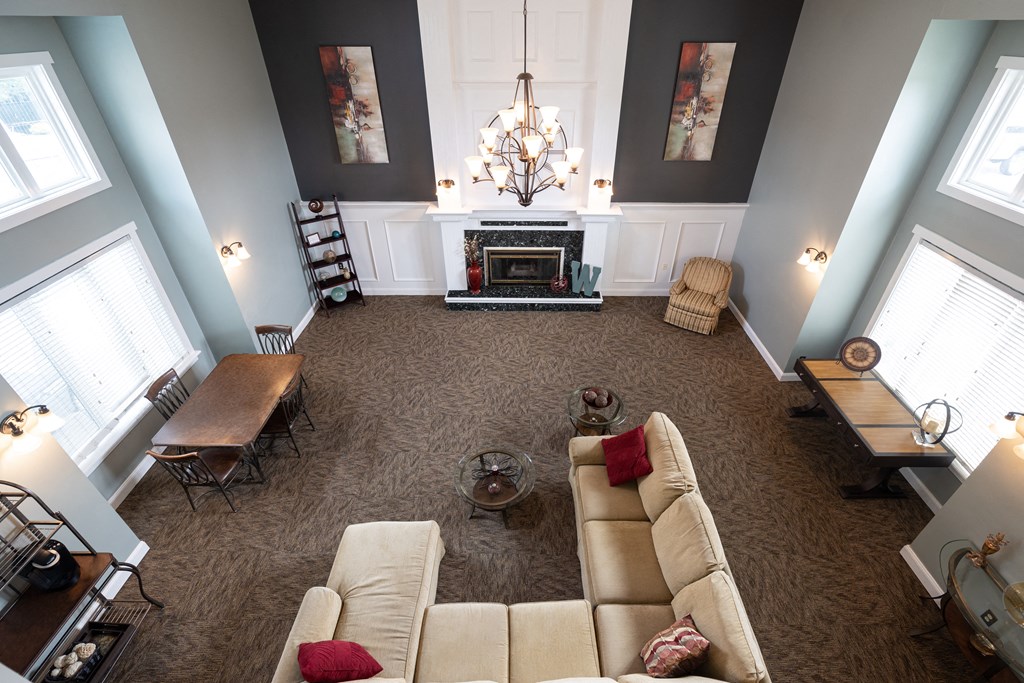 Inside the Wilshire clubhouse, showcasing a well-designed lounge area with seating arrangements for residents to socialize.