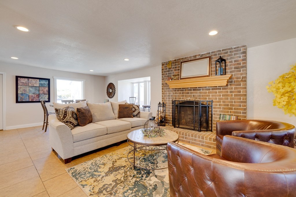 A classic living room in the clubhouse interior, featuring timeless furniture, comfortable seating arrangements, and tasteful decor, providing a welcoming and cozy communal space for residents to relax and socialize.