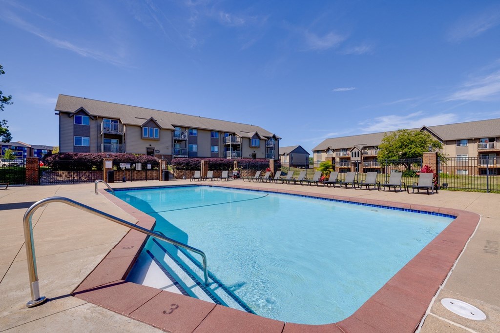 The exterior of the clubhouse, a charming and well-maintained building surrounded by lush landscaping, offering a central gathering place for residents to socialize and enjoy community events.