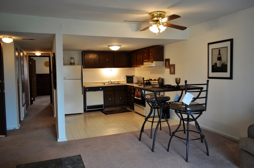Dining area in a Park 25 Apartments model unit, featuring a dining table and chairs, creating a warm and inviting space.