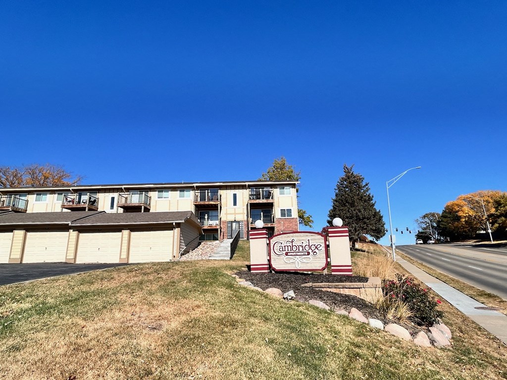 Cambridge Apartments sign placed at the main entrance to the property.