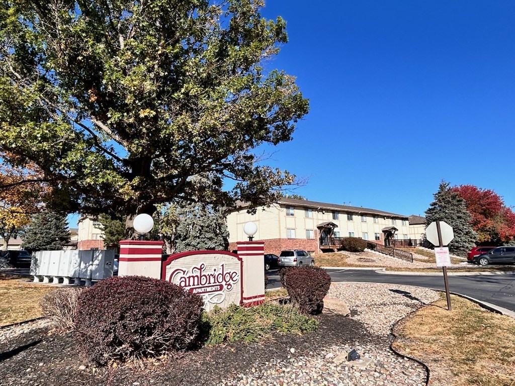 Signage for Cambridge Apartments, showcasing the community's name and entrance.