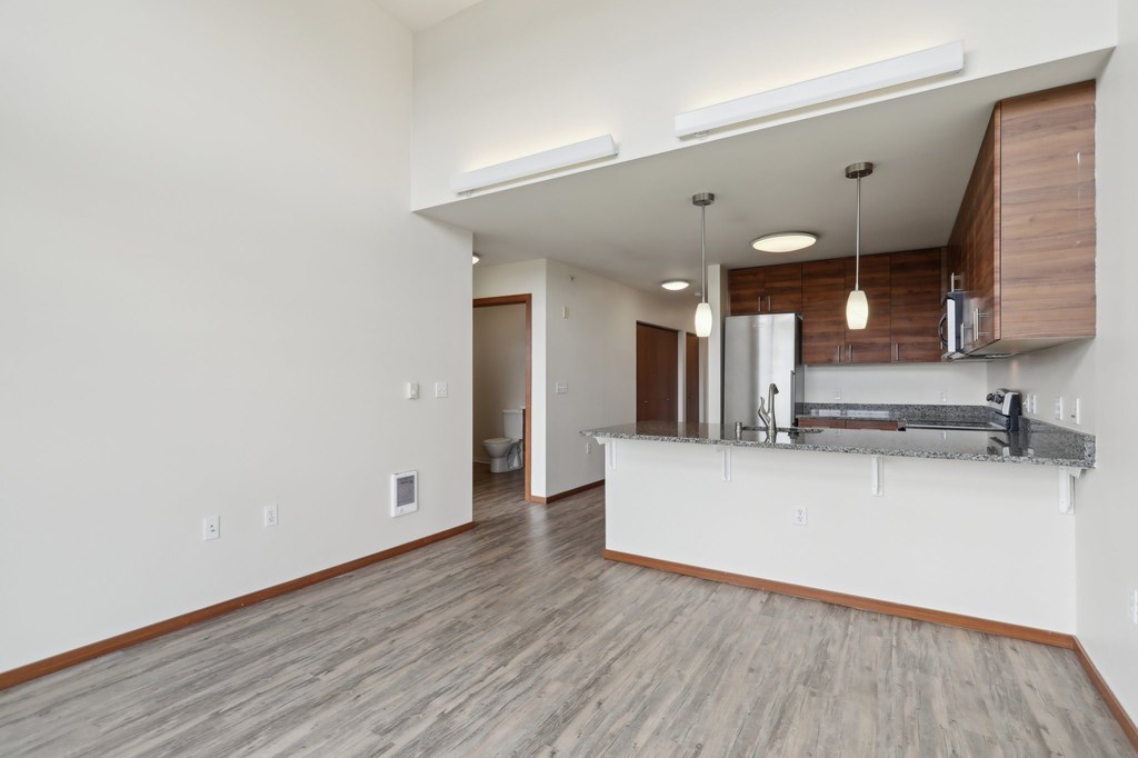A kitchen area with a countertop and cabinets.