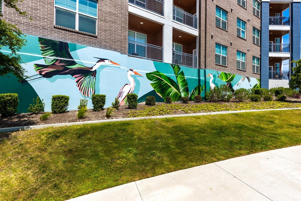 a mural on the side of an apartment building