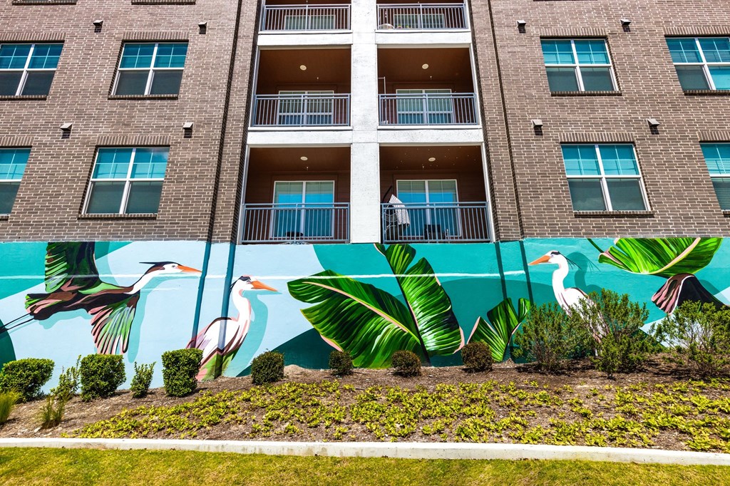 a mural on the side of an apartment building