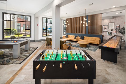 a clubhouse with a pool table and a foosball table