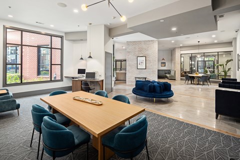 a communal area with a table and chairs