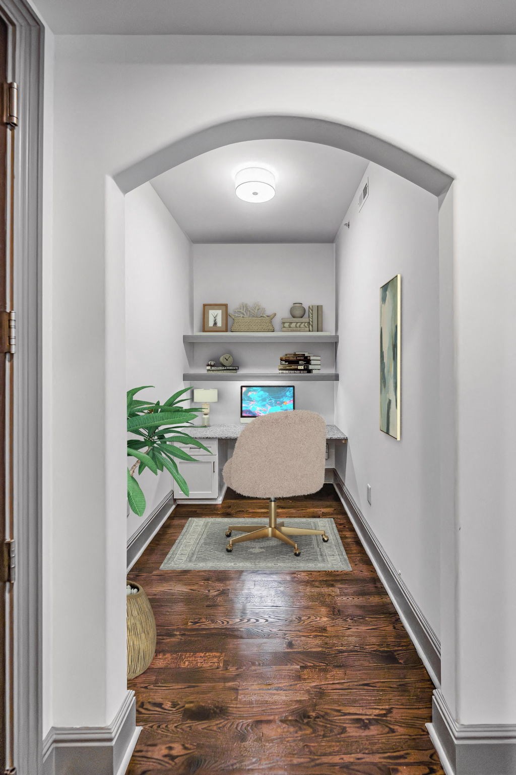 a home office with a desk and a chair