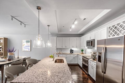 a kitchen with stainless steel appliances and a granite counter top