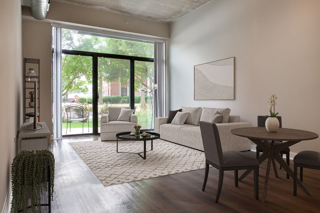 a living room with a couch and a table and a sliding glass door