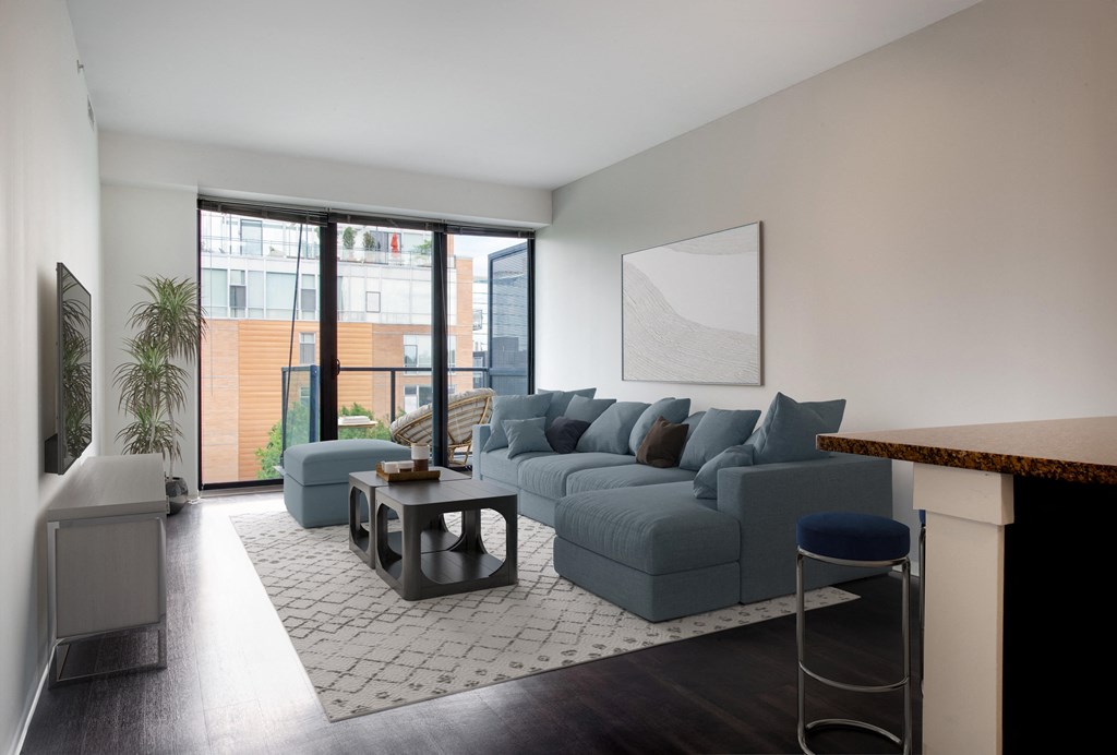 a living room with a blue couch and a coffee table