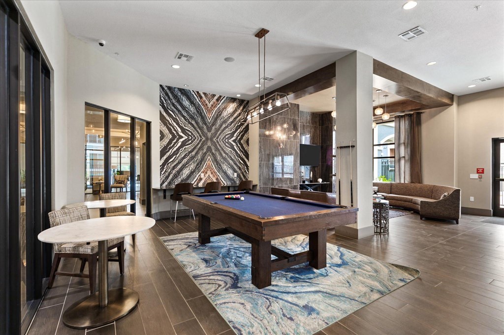 a resident clubhouse with a pool table
