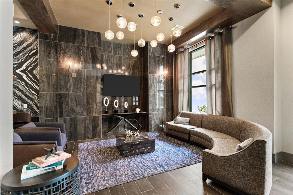 a living room filled with furniture and a large window