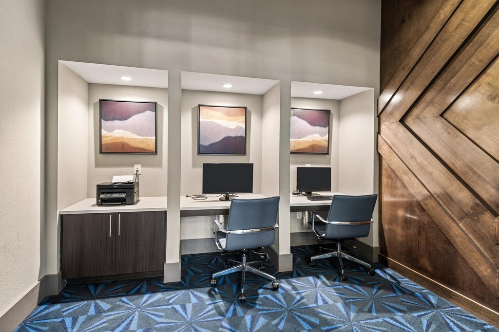 a room filled with furniture and a large wooden door