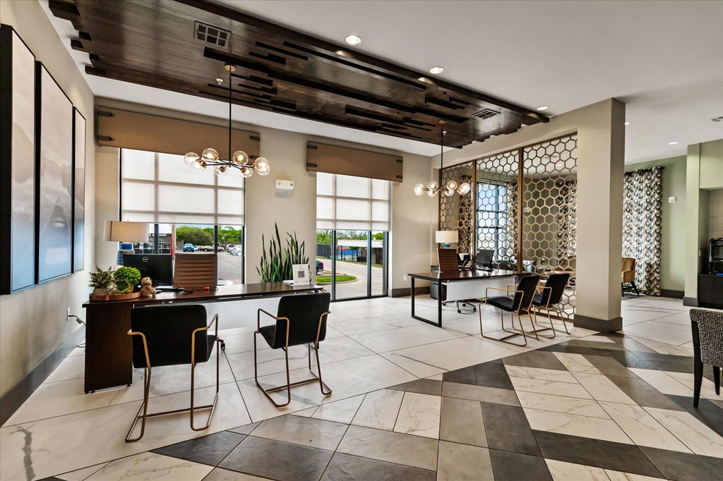 a large lobby with a checkerboard tile floor