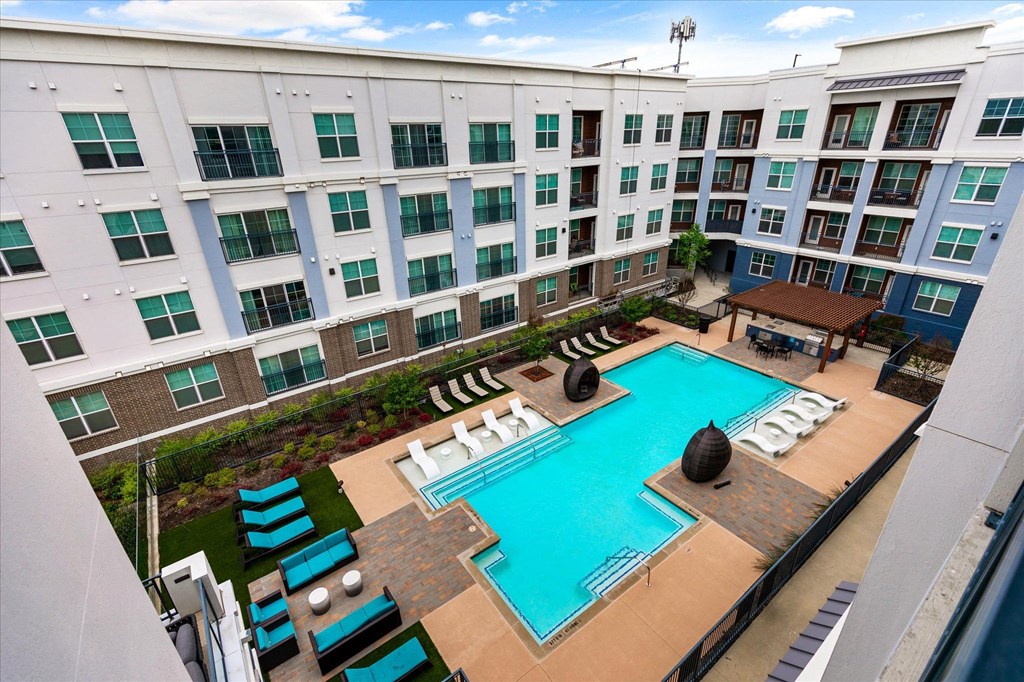 an aerial view of the pool and courtyard at the bradley braddock road station apartments