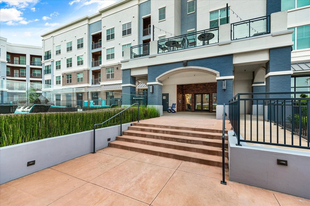 a large building with a staircase in front of it