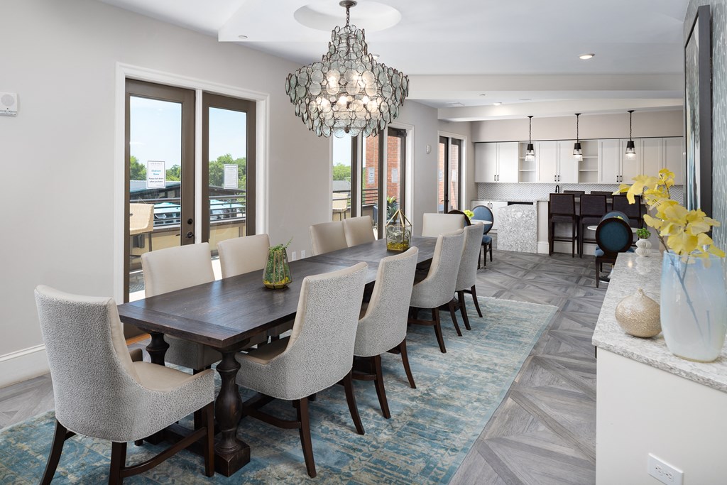 a dining room with a long table and chairs