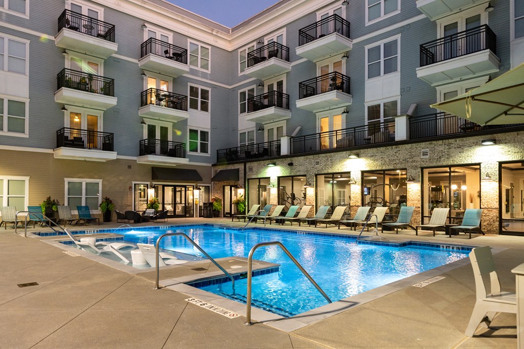a swimming pool in the middle of an apartment building