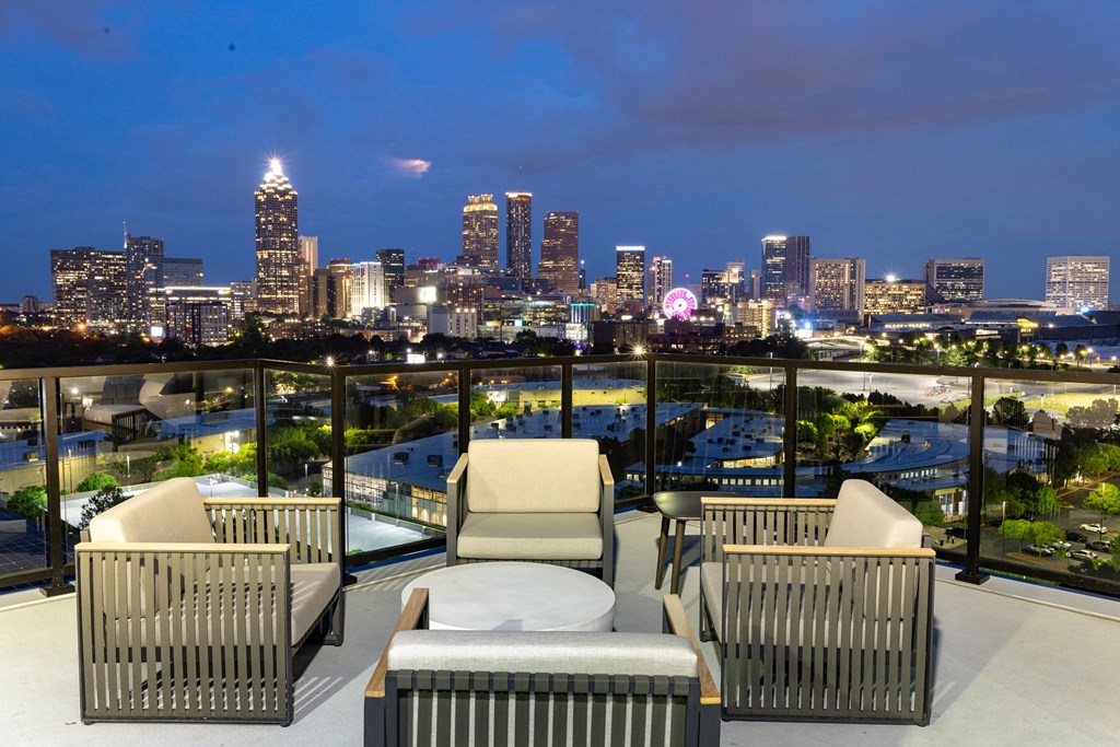 a balcony with a view of a city at night
