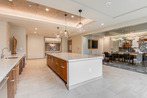 a large kitchen with a large island and a dining room