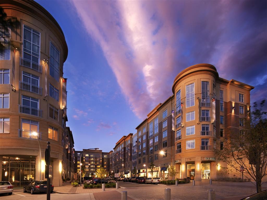 a view of a city street at night with buildings