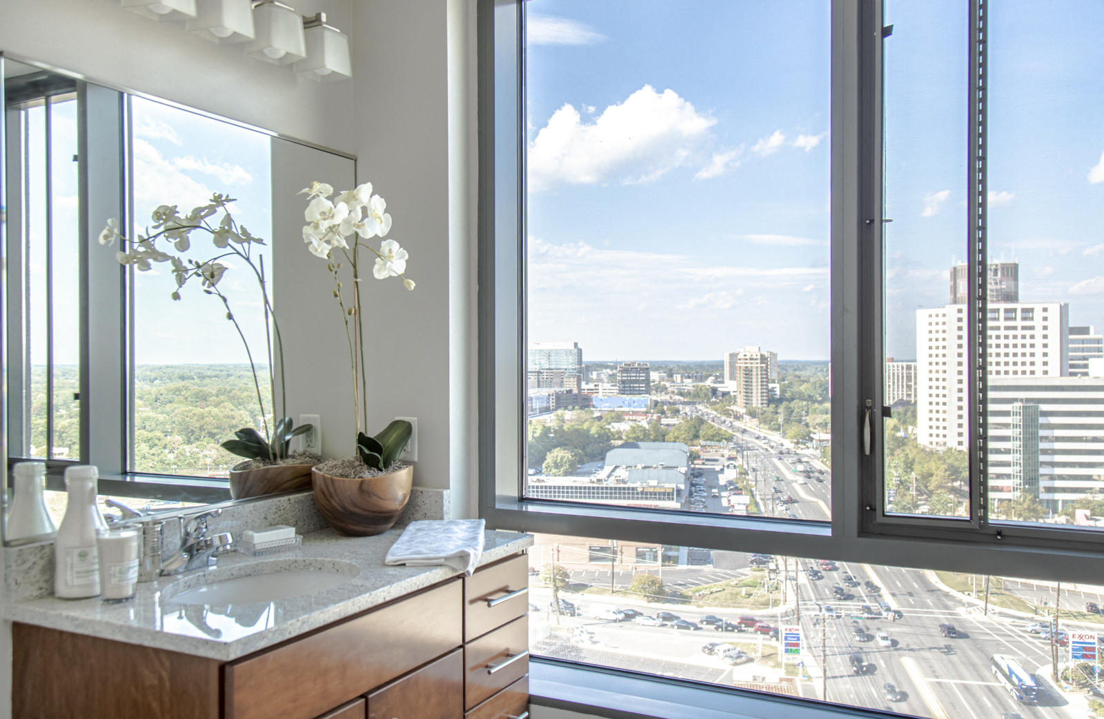 NoBe Market Apartments bathroom vanity and city view