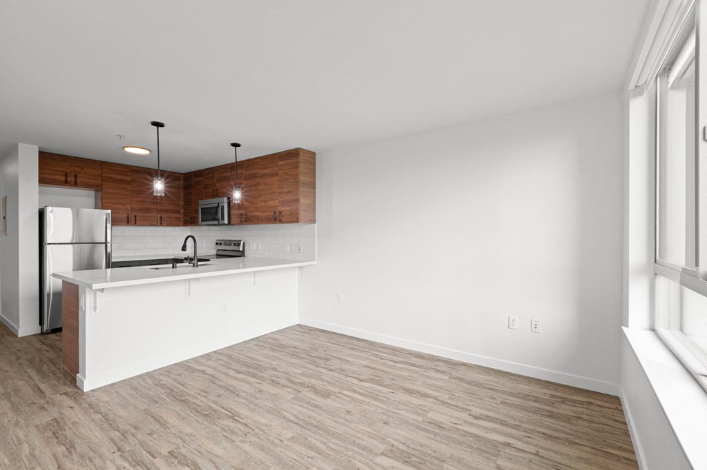 a kitchen and living room in a 555 waverly unit