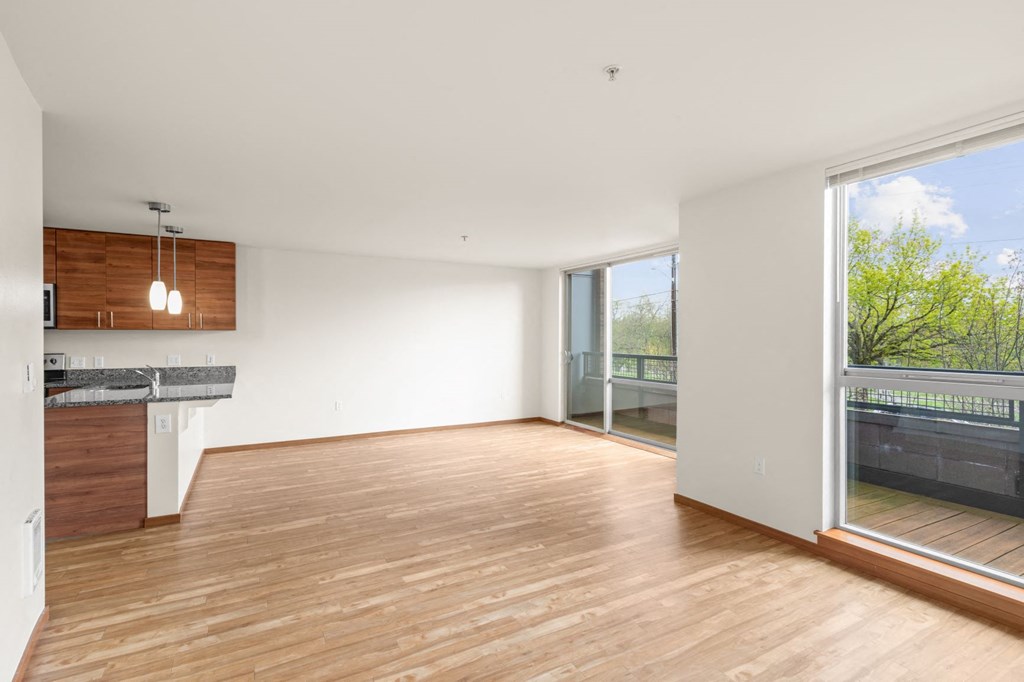 a kitchen and living room in a 555 waverly unit