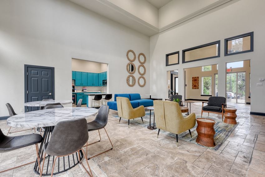 the reserve at bucklin hill clubhouse with tables and chairs and a kitchen in the background - Photo Gallery