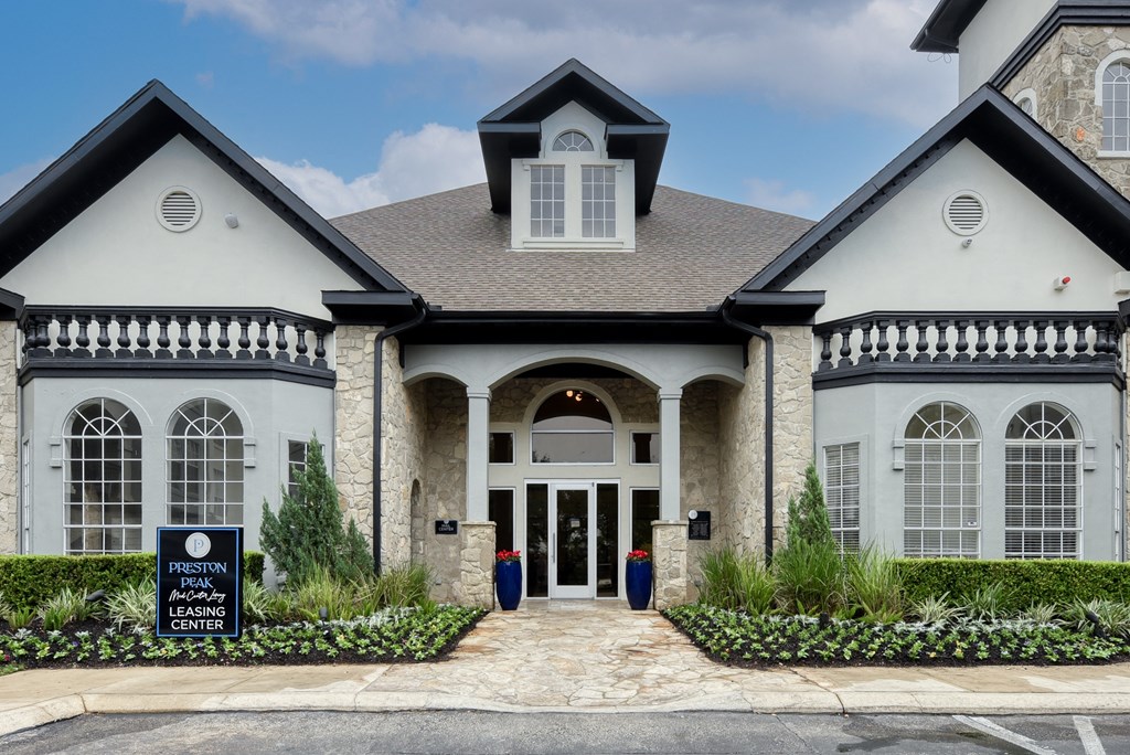 a home with a sign in front of it
