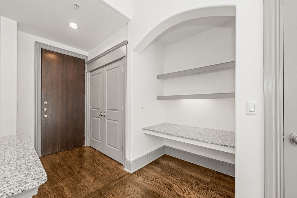 a bedroom with a closet and a door to a bathroom