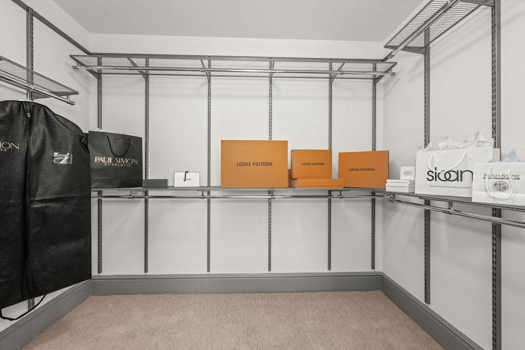 a room with boxes on top of a glass shelf