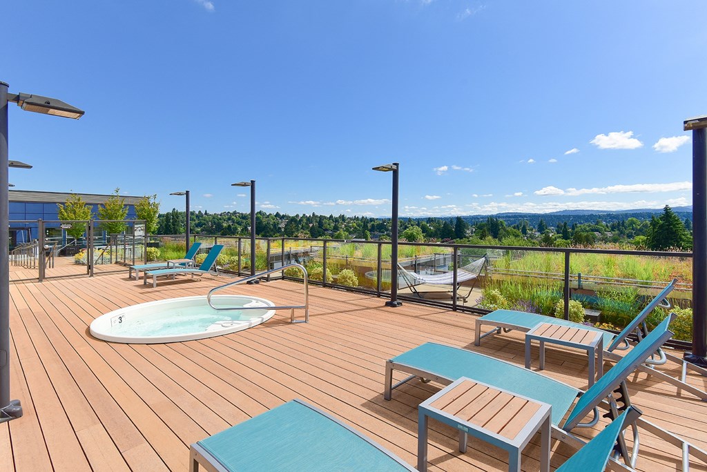 A deck with hot tub  at The Station at Othello Park South Seattle apartments