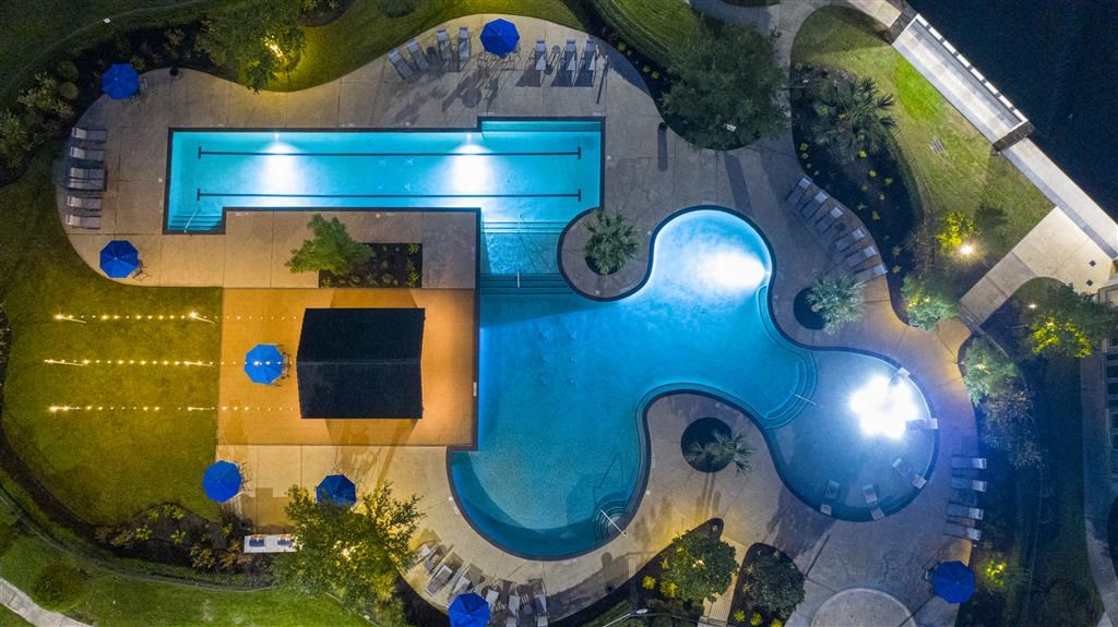 a birds eye view of a swimming pool at night