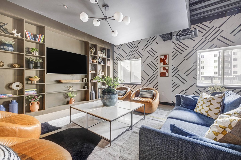 a living room with blue couches and a coffee table