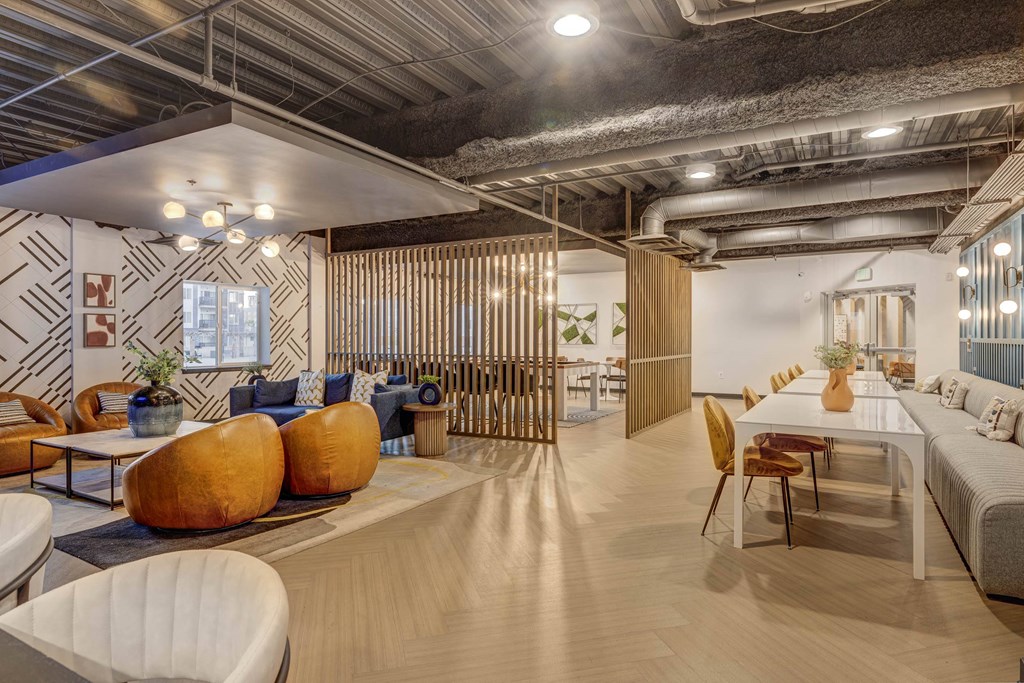 a living room and dining room with a table and chairs