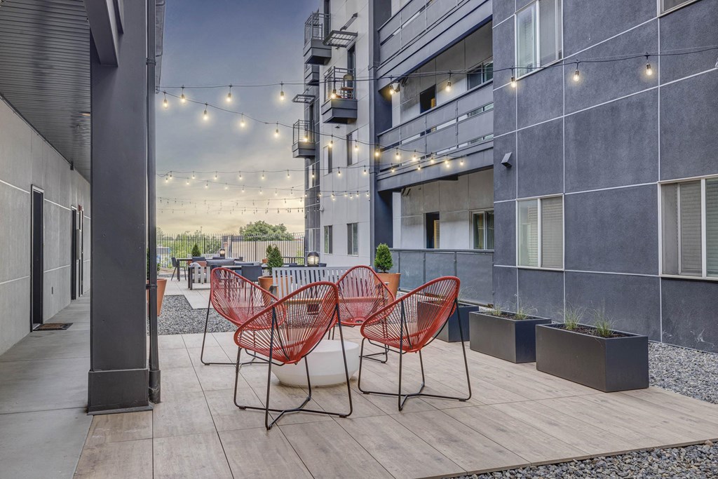 a communal area with chairs and tables in an office building