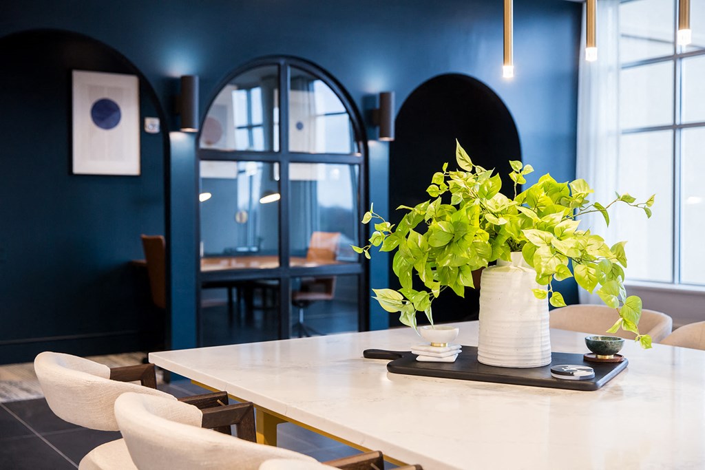 a long table with a vase of flowers on top of it