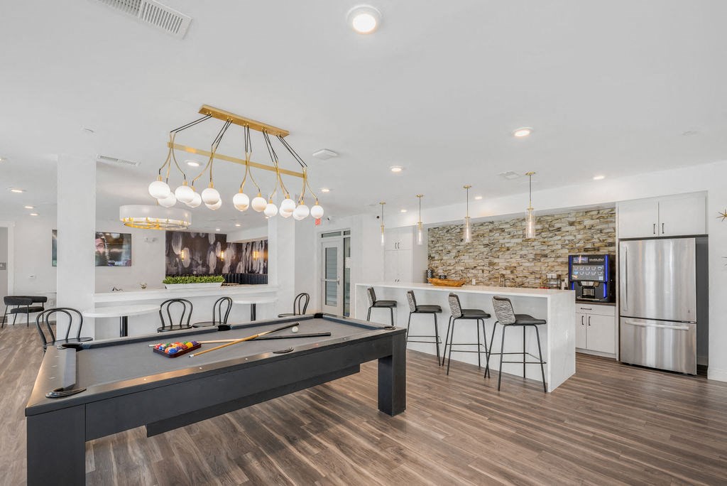 our apartments offer a clubhouse with a pool table and bar