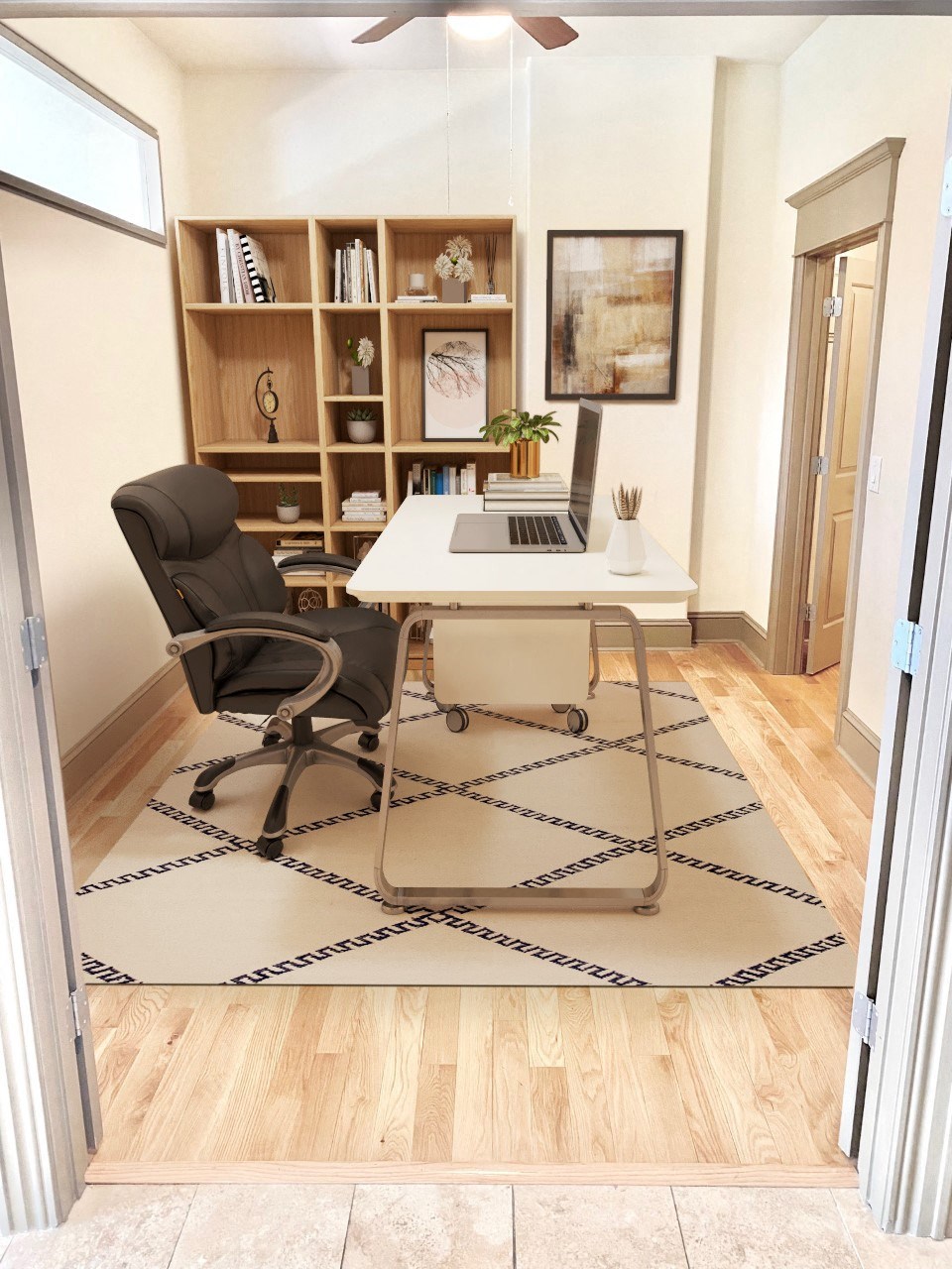 a home office with a desk and a chair and a rug