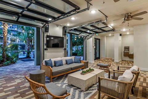 A living room with a grey sofa and a wooden coffee table.