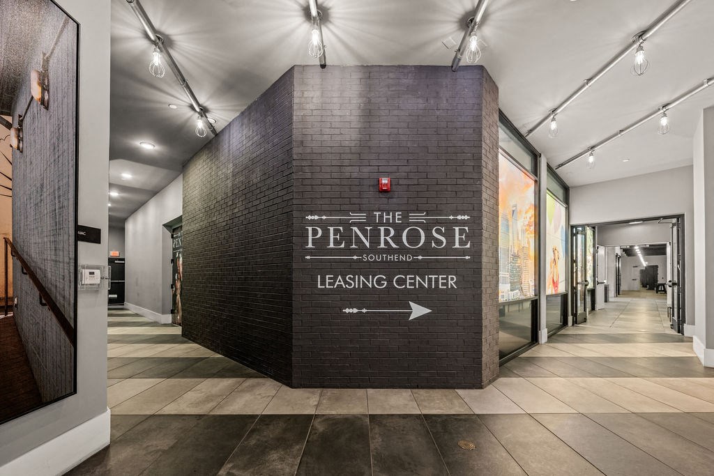A brick wall with Penrose Leasing Center written on it.