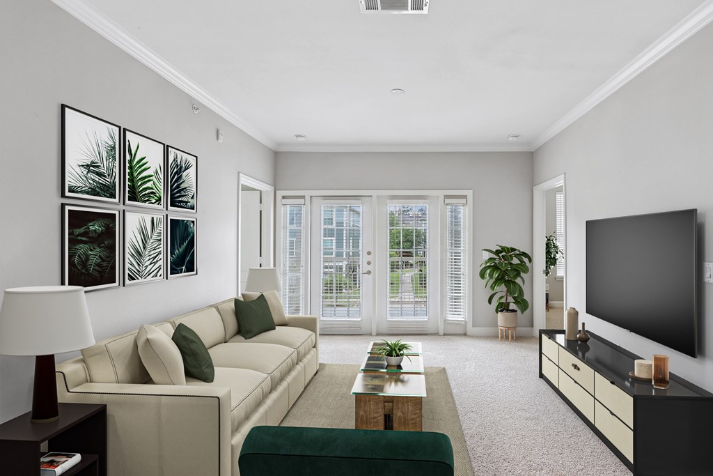 A living room with a couch, a coffee table, a lamp, and a television.
