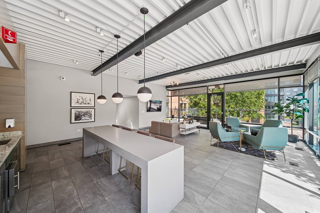A modern kitchen with a dining area and a view of the outdoors.